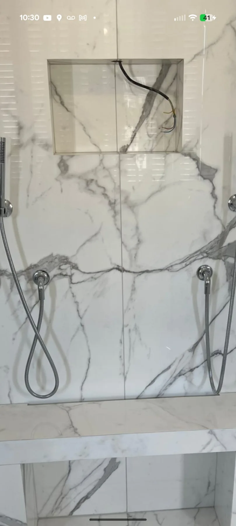 Marble-look shower tile and niche during a Berlin, Connecticut renovation