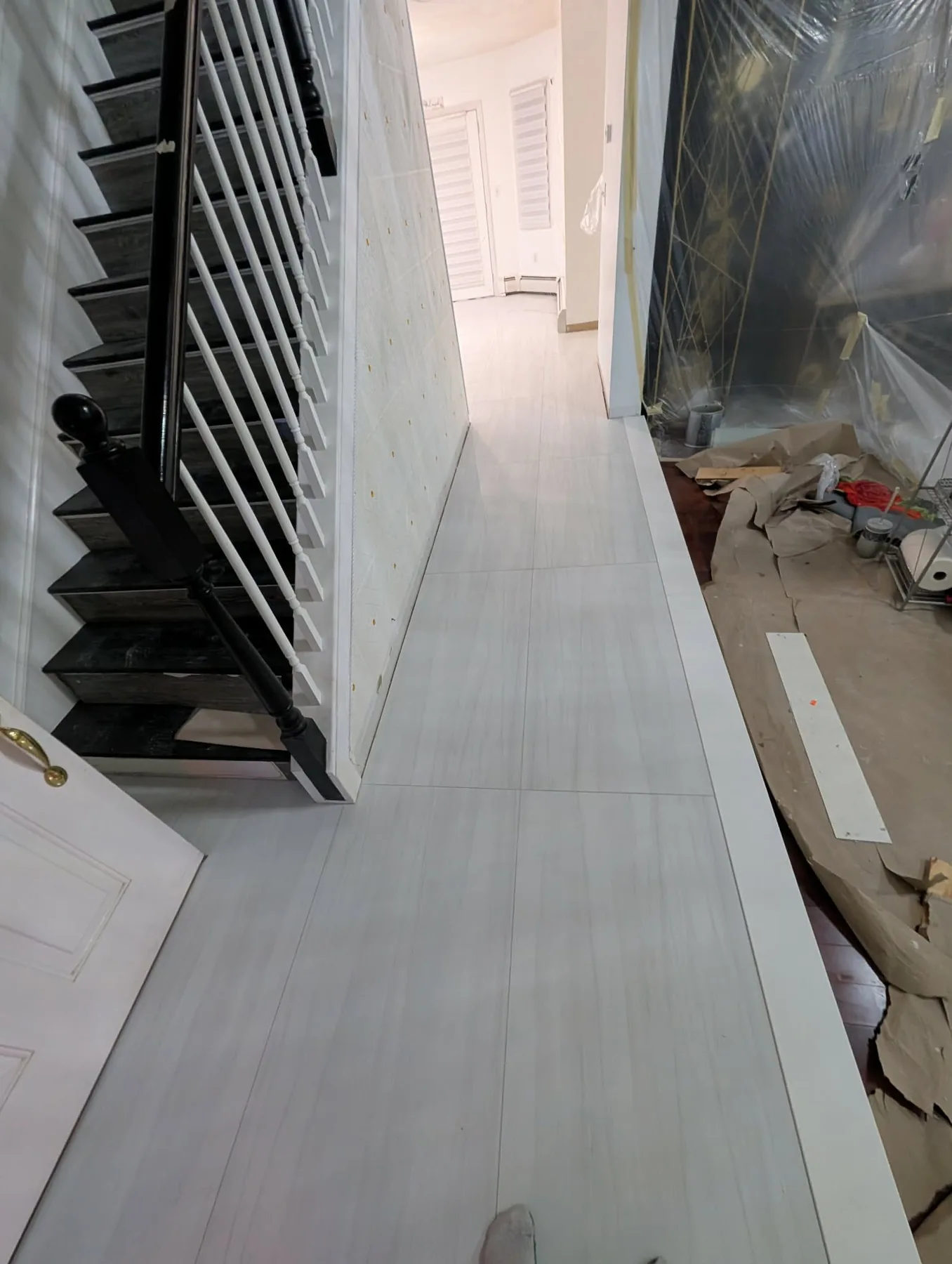 Light flooring installation near a stair in Rocky Hill, Connecticut