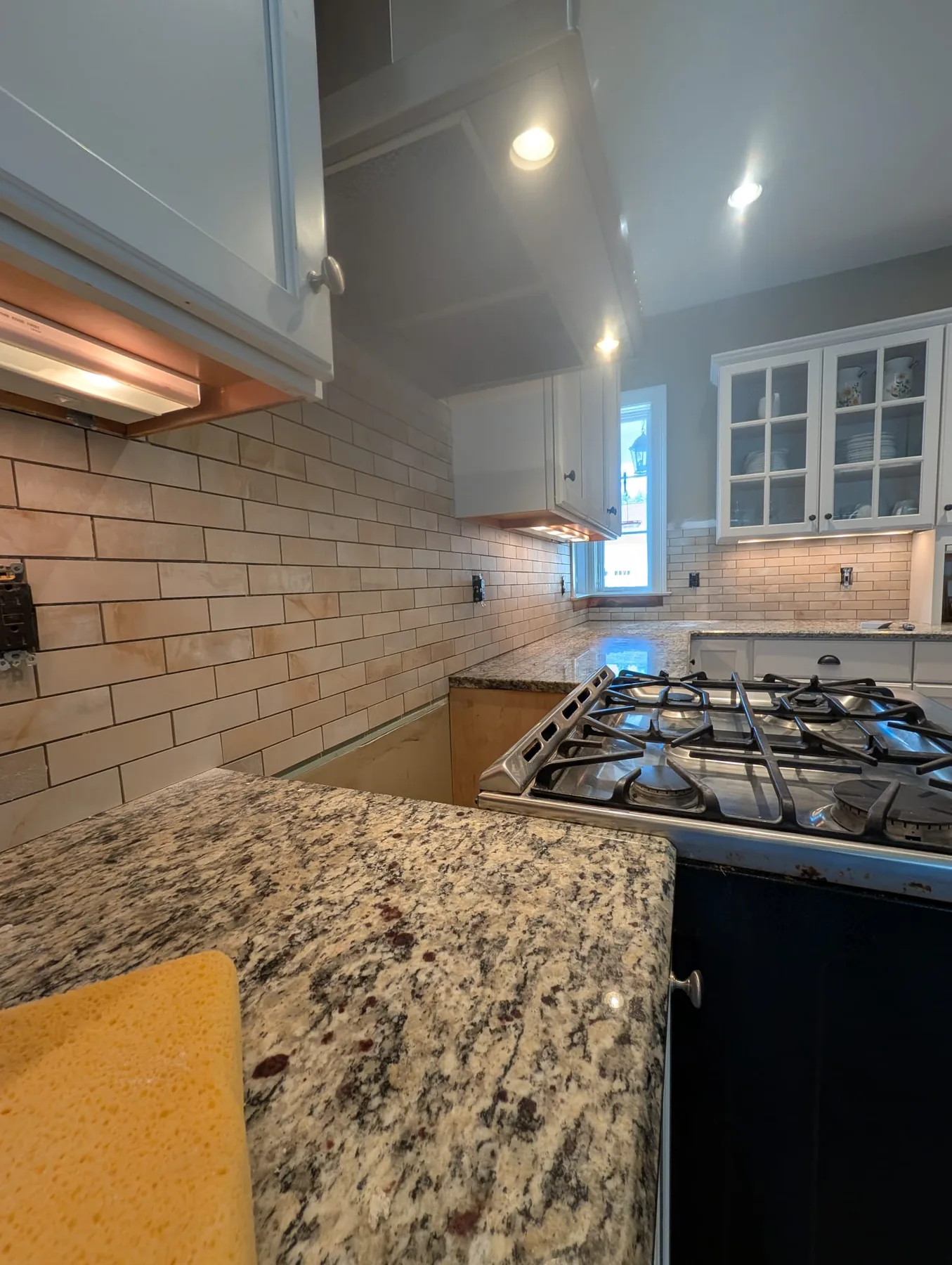Speckled countertop and subway-tile backsplash in Simsbury, Connecticut