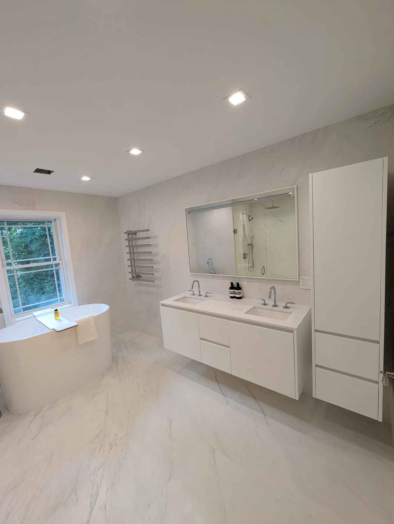 White vanity and tiled bathroom in Southington, Connecticut