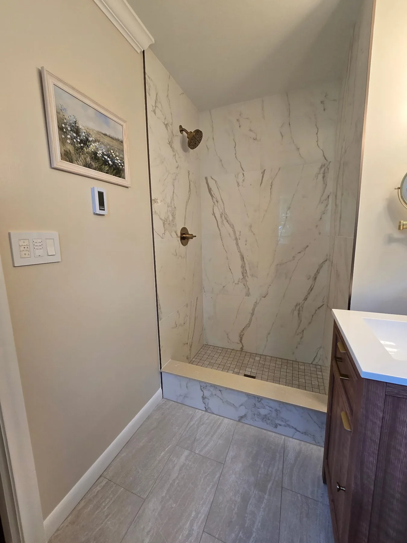 Marble-look shower and gray floor tile in Unionville, Connecticut
