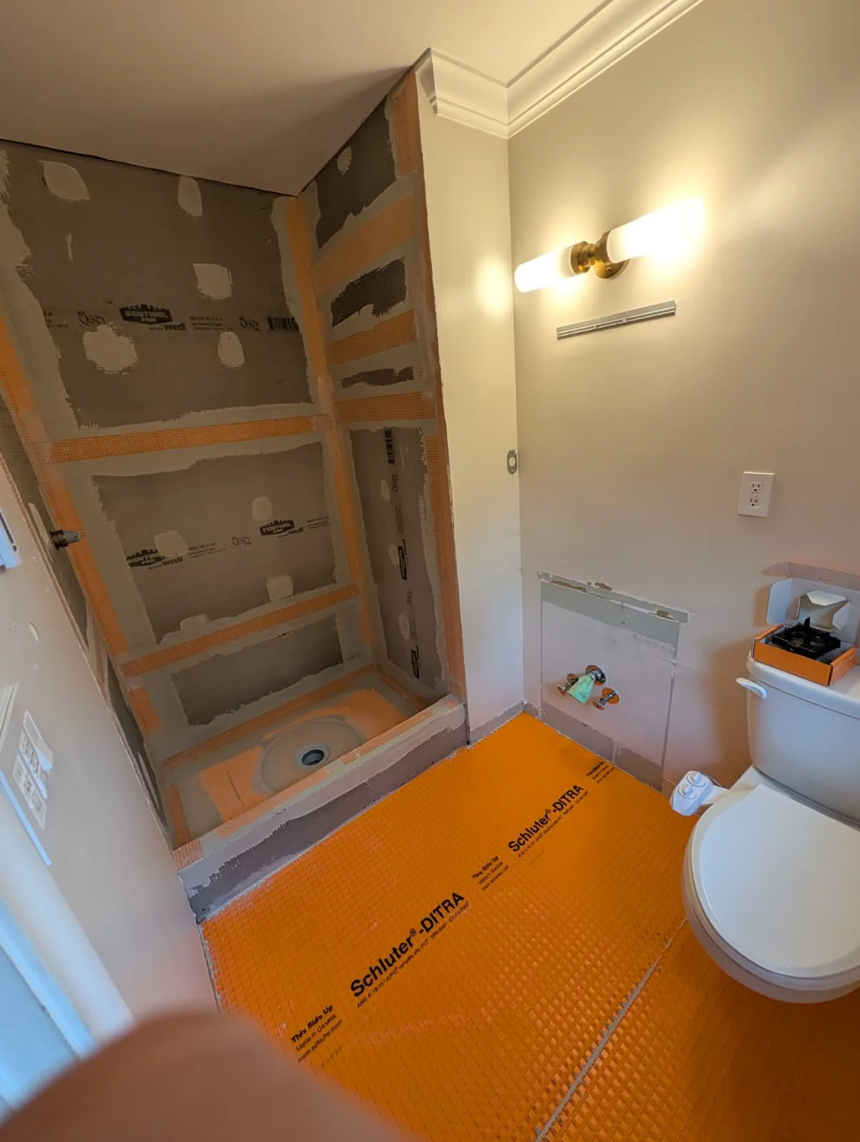 Bathroom shower and floor waterproofing in progress